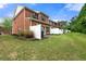 Townhome exterior showcasing well-maintained lawn and private back patios at 5654 Lawley Dr, Alpharetta, GA 30022
