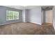 Spacious bedroom with plush carpeting and abundant natural light at 5654 Lawley Dr, Alpharetta, GA 30022