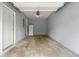 Attached one car garage with painted walls and an extra refrigerator at 5654 Lawley Dr, Alpharetta, GA 30022