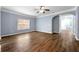 Spacious living room features wood-look flooring, a window, and an open archway at 5654 Lawley Dr, Alpharetta, GA 30022