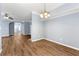 View of the living space highlighting wood floors and arched doorways at 5654 Lawley Dr, Alpharetta, GA 30022
