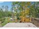 Expansive backyard deck with cable railing overlooking lush greenery and neighborhood at 2396 Sunset Ne Dr, Atlanta, GA 30345