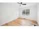 Bright bedroom with hardwood floors and a ceiling fan, filled with natural light from the window at 2396 Sunset Ne Dr, Atlanta, GA 30345