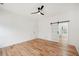 Bright bedroom with hardwood floors, sliding glass doors, and a view to a bonus space at 2396 Sunset Ne Dr, Atlanta, GA 30345