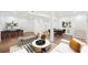 Open concept living room featuring a stylish bar area, game table, and neutral decor at 2396 Sunset Ne Dr, Atlanta, GA 30345