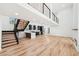 Sun-drenched living room with hardwood floors and staircase leading to a second story at 2396 Sunset Ne Dr, Atlanta, GA 30345