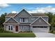 Charming two-story home showcasing a brick and siding facade, complemented by a well-manicured lawn at 294 Pickens Bluff Ln, Hiram, GA 30141