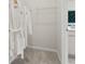 Walk-in closet with carpet flooring, wire shelving, and hanging white robes at 407 Nix Ln, Lawrenceville, GA 30046