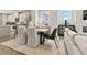 Bright dining area with an open concept design, connecting the kitchen and living room at 407 Nix Ln, Lawrenceville, GA 30046