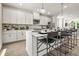 Stylish kitchen with a quartz island, modern appliances, and bar stool seating that's perfect for entertaining guests at 407 Nix Ln, Lawrenceville, GA 30046
