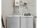 Laundry room featuring a washer, a dryer, and white wire shelving above at 407 Nix Ln, Lawrenceville, GA 30046