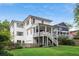Back exterior of a beautiful home featuring a well-kept lawn, and a back balcony at 519 2Nd Ave, Decatur, GA 30030