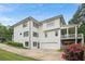 Two-story home featuring a back balcony, a two car garage, and well-maintained lawn at 519 2Nd Ave, Decatur, GA 30030