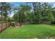 Spacious backyard with a cozy fire pit area and lush green lawn at 519 2Nd Ave, Decatur, GA 30030