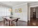 Dining room with large windows, modern lighting, hardwood floors and light walls at 519 2Nd Ave, Decatur, GA 30030