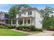 Charming two-story home with a welcoming front porch and well-manicured landscaping at 519 2Nd Ave, Decatur, GA 30030