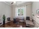 Bright home office with hardwood floors, a large window, and contemporary furnishings at 519 2Nd Ave, Decatur, GA 30030