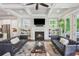 Large, bright living room includes built-in shelving, a fireplace, and a view into the kitchen at 519 2Nd Ave, Decatur, GA 30030