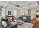 Open-concept living room with hardwood floors, stylish furniture, and a view to the modern kitchen at 519 2Nd Ave, Decatur, GA 30030