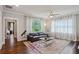 Cozy living room with hardwood floors, a leather sofa, large windows, and modern decor at 519 2Nd Ave, Decatur, GA 30030