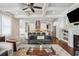 Open-concept living room flows seamlessly into the kitchen area with hardwood floors and ample light at 519 2Nd Ave, Decatur, GA 30030