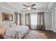 Main bedroom features a tray ceiling, hardwood floors, neutral paint, and large windows at 519 2Nd Ave, Decatur, GA 30030