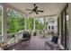Inviting covered porch with elegant seating, and picturesque views of the surrounding trees at 519 2Nd Ave, Decatur, GA 30030