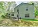 Backyard with ample greenspace, stone patio and siding exterior at 655 Barrington Way, Roswell, GA 30076