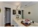 Bathroom with a large mirror, single sink, and great lighting at 655 Barrington Way, Roswell, GA 30076