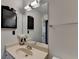 Bathroom with a large mirror, single sink, and great lighting at 655 Barrington Way, Roswell, GA 30076