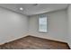 Bedroom featuring wood floors and neutral colored walls and natural light at 655 Barrington Way, Roswell, GA 30076
