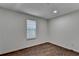 Bedroom featuring wood floors and neutral colored walls and natural light at 655 Barrington Way, Roswell, GA 30076