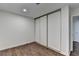 Bedroom features wood-look flooring and a closet with sliding doors at 655 Barrington Way, Roswell, GA 30076