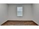 Bedroom featuring wood floors and neutral colored walls and natural light at 655 Barrington Way, Roswell, GA 30076