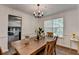 Warm dining area with wooden table, stylish decor, and easy access to adjacent rooms at 655 Barrington Way, Roswell, GA 30076