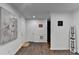 Spacious entryway featuring hard surface flooring, decor, and access to the staircase at 655 Barrington Way, Roswell, GA 30076