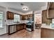 Bright kitchen featuring stainless appliances and wood cabinets at 655 Barrington Way, Roswell, GA 30076