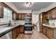 Kitchen with stainless steel appliances and wood cabinets at 655 Barrington Way, Roswell, GA 30076