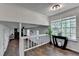 Spacious living area with hardwood floors, white trim, and a view of the fireplace at 655 Barrington Way, Roswell, GA 30076