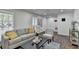 Comfortable living room with stylish seating, a modern coffee table, and natural light at 655 Barrington Way, Roswell, GA 30076