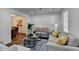 Bright living room with hardwood floors, modern decor, and an open layout to the dining area at 655 Barrington Way, Roswell, GA 30076