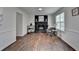 Living room featuring hardwood floors, fireplace, and natural light at 655 Barrington Way, Roswell, GA 30076