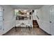 Bright living room featuring hardwood floors, and a view of the kitchen and stairs at 655 Barrington Way, Roswell, GA 30076