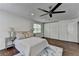 Spacious main bedroom with hardwood floors, ceiling fan, closet and natural light at 655 Barrington Way, Roswell, GA 30076