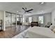 Spacious main bedroom with hardwood floors, ceiling fan and mirrored closet doors at 655 Barrington Way, Roswell, GA 30076