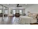 Spacious main bedroom with hardwood floors, ceiling fan and ample closet space at 655 Barrington Way, Roswell, GA 30076