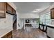 Open layout featuring hardwood floors, a staircase, and a bright living area with large windows at 655 Barrington Way, Roswell, GA 30076