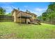 Lush green backyard with a wooden deck perfect for outdoor dining and entertaining at 1188 Cedar Park Cir, Stone Mountain, GA 30083