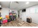 Unfinished basement area with potential, featuring storage, concrete flooring and a freezer at 1188 Cedar Park Cir, Stone Mountain, GA 30083