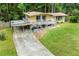 Charming home with a spacious driveway, open patio, and beautifully landscaped front yard at 1188 Cedar Park Cir, Stone Mountain, GA 30083